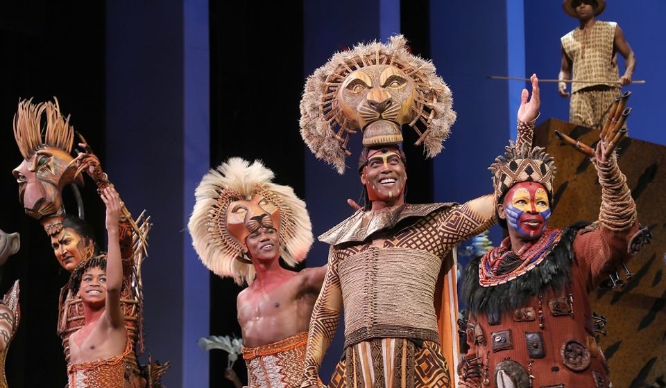 Cast members from The Lion King on stage